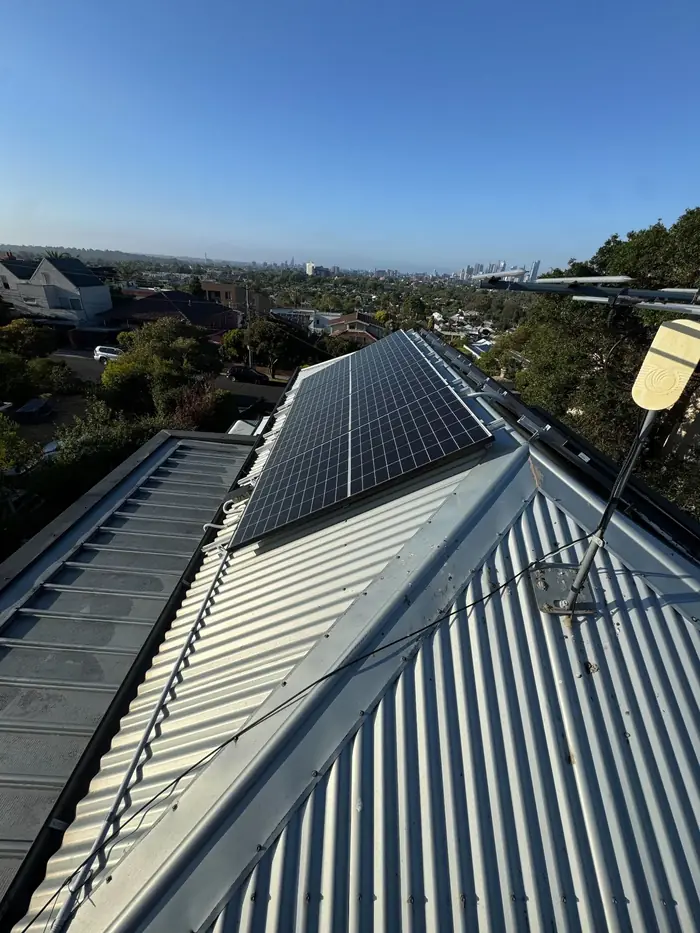 Solar panels on a Colorbond roof overlooking Melbourne