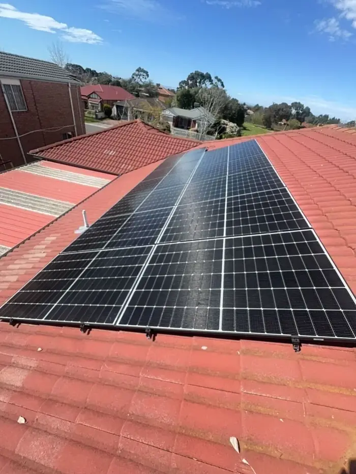 Solar panels installed on a terracotta tiled roof